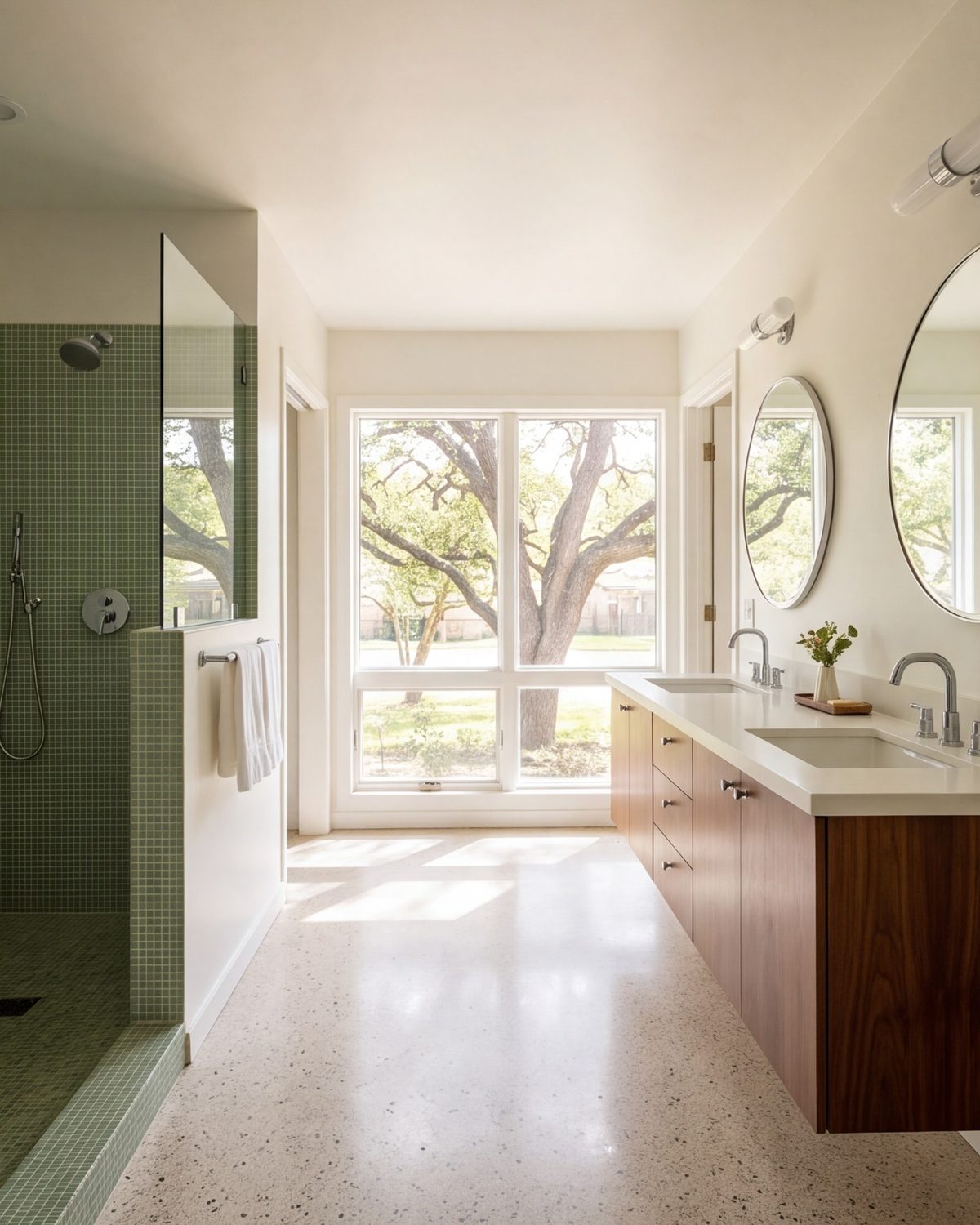 1950s ranch primary bathroom with double vanity and roomy shower in soft daylight